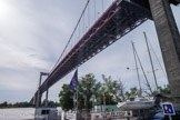 Bordeaux. <br> Le pont d'Aquitaine est un pont suspendu situé sur la rocade de Bordeaux. Les travaux de construction ont débuté en 1961 pour une inauguration en 1967. L'ouvrage a une portée de 394 m pour une longueur de 1 767 m, ce qui en fait le deuxième plus grand pont suspendu de France, après le pont de Tancarville..