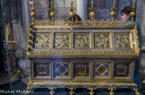 <center>Reliques et châsse de sainte Geneviève, Patronne de Paris. </center> Placide Poussielgue-Rusand, orfèvre. Bronze doré, émaux. Vers 1850. Provenant du Panthéon, ancienne église Sainte-Geneviève à Paris. Geneviève (420-500 env.) est remarquée toute jeune par l'évêque saint Germain d'Auxerre qui la consacre à Dieu. Assidue à la prière, pleine de force d'âme et d'espérance, attentive aux pauvres, son rayonnement est grand. Elle initie ainsi la construction d'une basilique sur le tombeau de saint Denys, premier évêque de Paris. Elle restaure le courage des parisiens devant la menace d'Attila (451) et les sauve de la famine en organisant des convois de vivres depuis la Champagne (470). Devenue l'amie du roi Clovis er de la reine Clotilde, elle devient « Mère de la Patrie menacée ». Elle est représentée tenant à la main le cierge avec lequel elle ranima la flamme de ses compagnes dans la tempête comme elle ranima plusieurs fois l'espérance des parisiens.