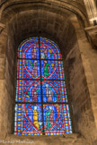 <center></center><center>Eglise Saint-Germain-des-Prés. </center> Vitrail de la chapelle Sainte-Geneviève. Ces vitraux sont caractéristiques de la production du XIIIe siècle et du règne de saint Louis. Ils sont constitués à partir de fragments de vitraux de la chapelle de la Vierge et du réfectoire des moines. Les Œuvres de miséricorde.
