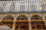 <center>Galerie Vivienne.  </center> La galerie Vivienne résiste au départ du duc d'Orléans, devenu Louis-Philippe, pour les Tuileries. Toutefois, en 1880 s'installe une épicerie qui deviendra les caves Legrand, ouvertes sur la galerie et sur la rue de la Banque.
