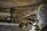 <center></center><center>Les Catacombes de Paris. </center> Sculptures de Port-Mahon. Travaillant la journée aux travaux de consolidation sous la direction de Guillaumot, il sculpte après son travail et représente une maquette ainsi que diverses vues du fort de Port-Mahon, la principale ville de l'île de Minorque, aux Baléares, où il aurait été un temps prisonnier des Anglais. Voulant parfaire son œuvre, il engage la création d'un escalier d'accès depuis le niveau supérieur de la carrière ; mais il provoque ainsi un fontis qui le tue sur le coup.