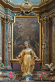 <center>Conflans et son Église baroque Saint-Grat.</center> Le tableau met en scène la Vierge Marie tenant dans ses bras l’Enfant Jésus. Marie remet le rosaire à saint Dominique, alors que l’Enfant tend une couronne d’épines à sainte Catherine de Sienne. La Vierge et l’Enfant ne sont pas placés au centre, mais sont sur la gauche, les deux autres personnages étant de ce fait en bas à droite. Sur l’autel est placée la statue en bois doré de la Vierge, elle est représentée marchant sur le serpent, symbolisant la nouvelle Eve.